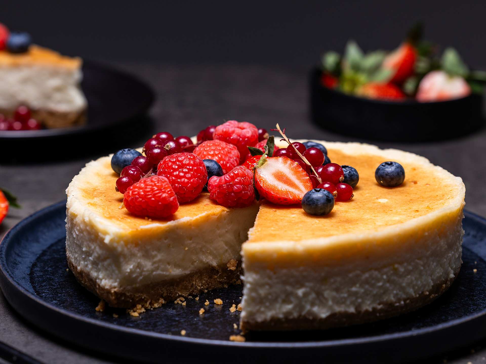 A dairy-free cheesecake topped with fresh strawberries and blueberries A dairy-free cheesecake topped with fresh strawberries and blueberries