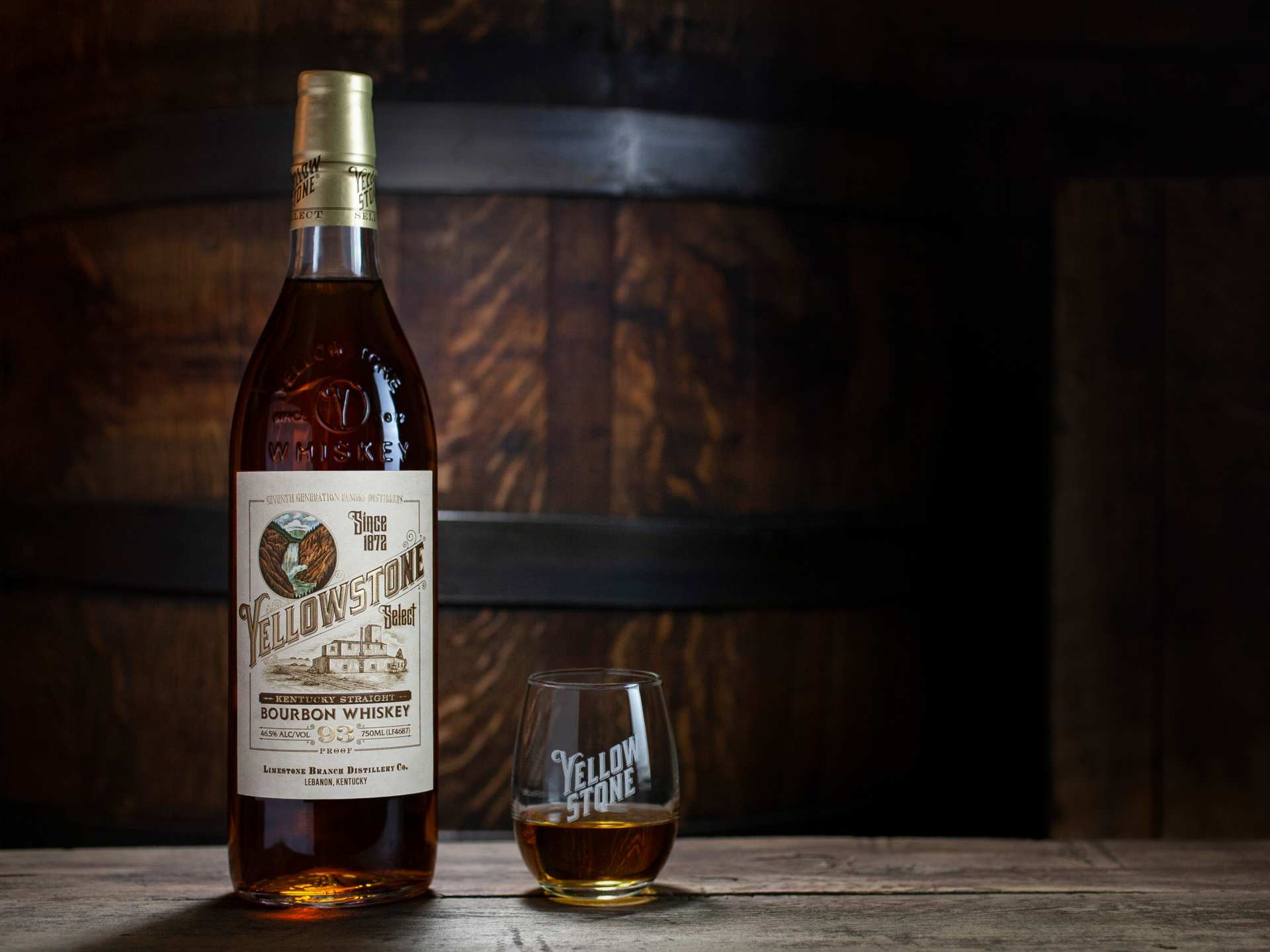 A bottle of Yellowstone Select Kentucky Straight Bourbon Whiskey with a glass