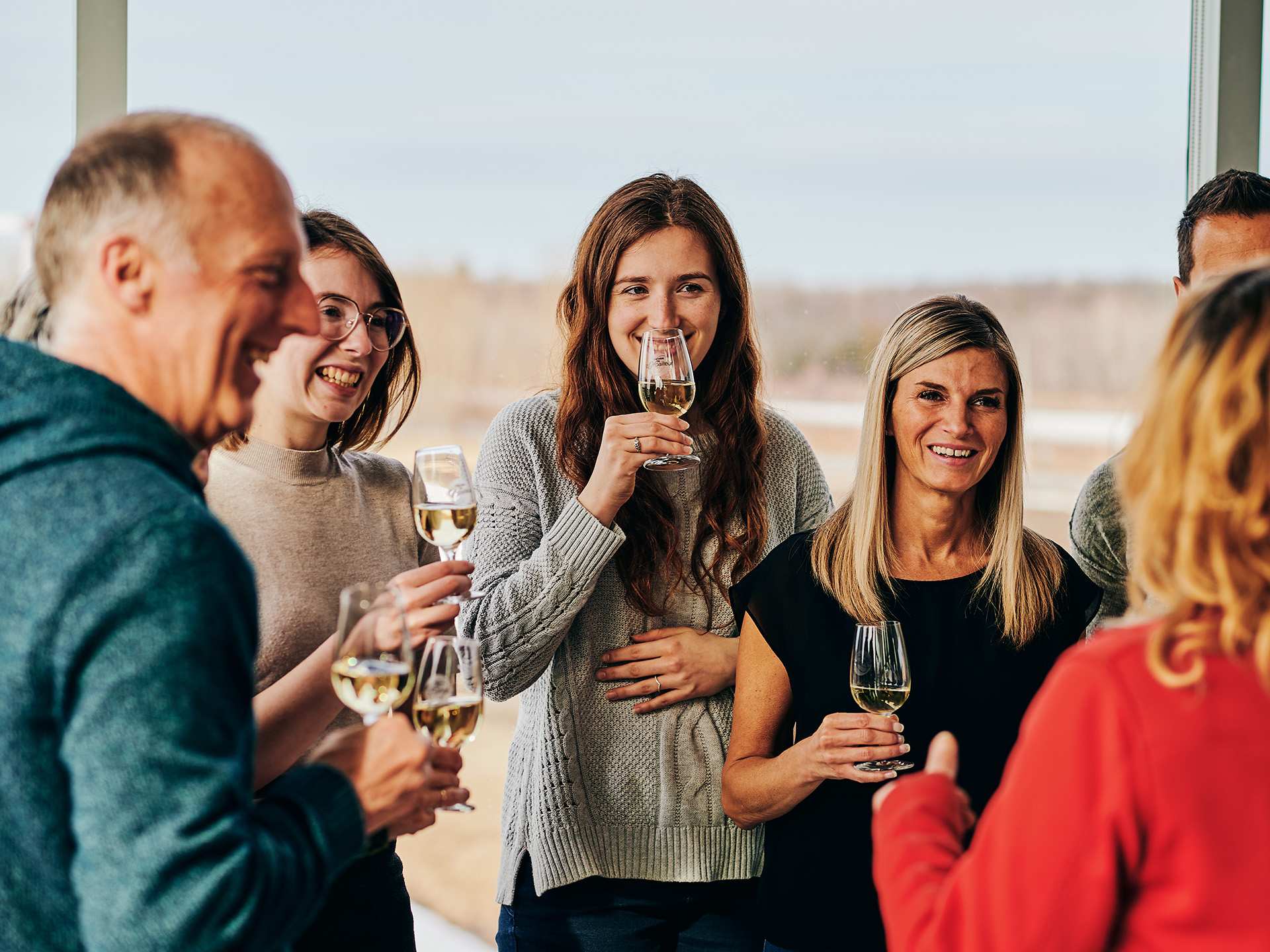 A group of people enjoying wine A group of people enjoying wine