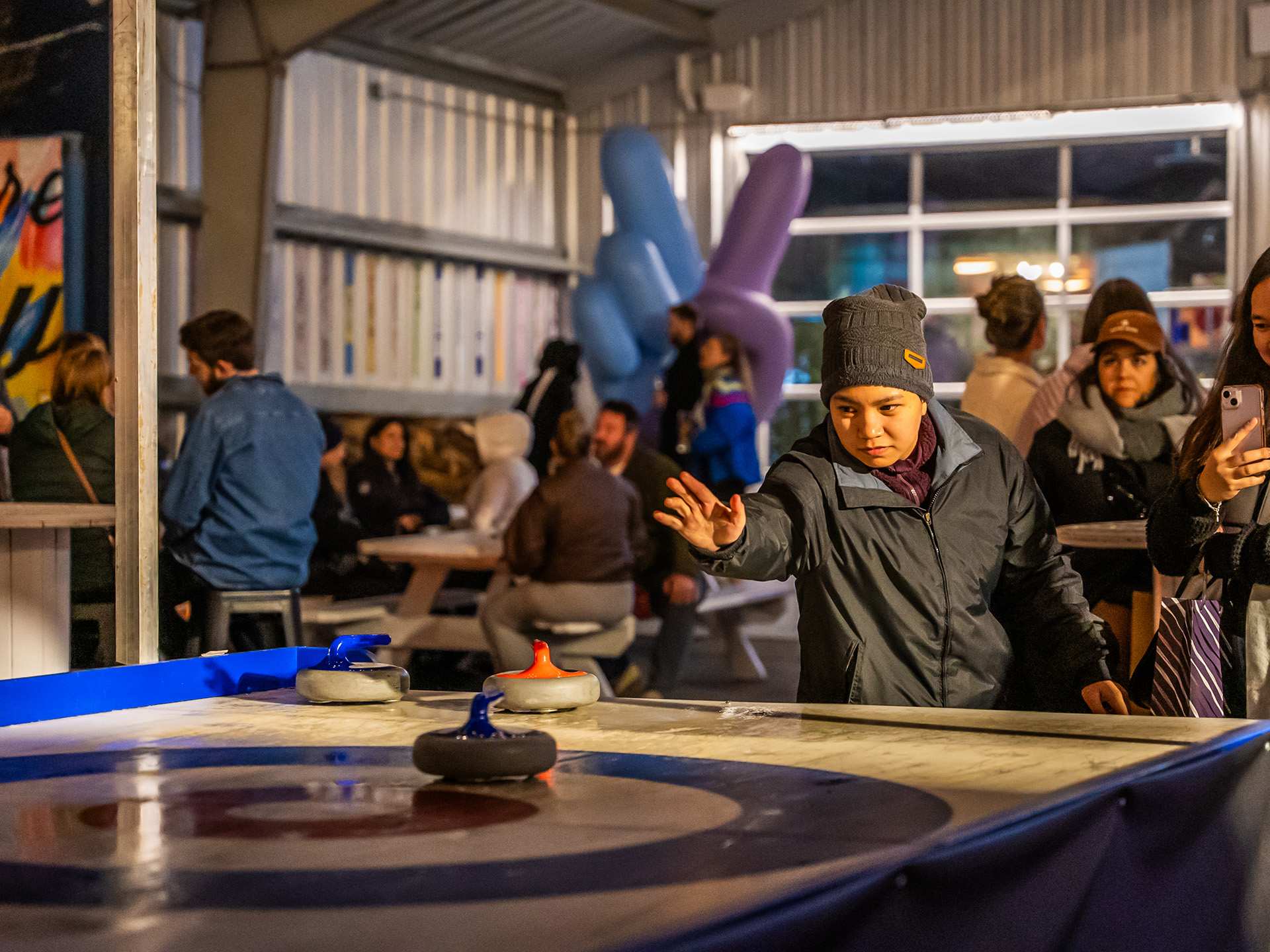 Christmas bars and markets in Toronto | Table curling at Stackt Holiday Hills