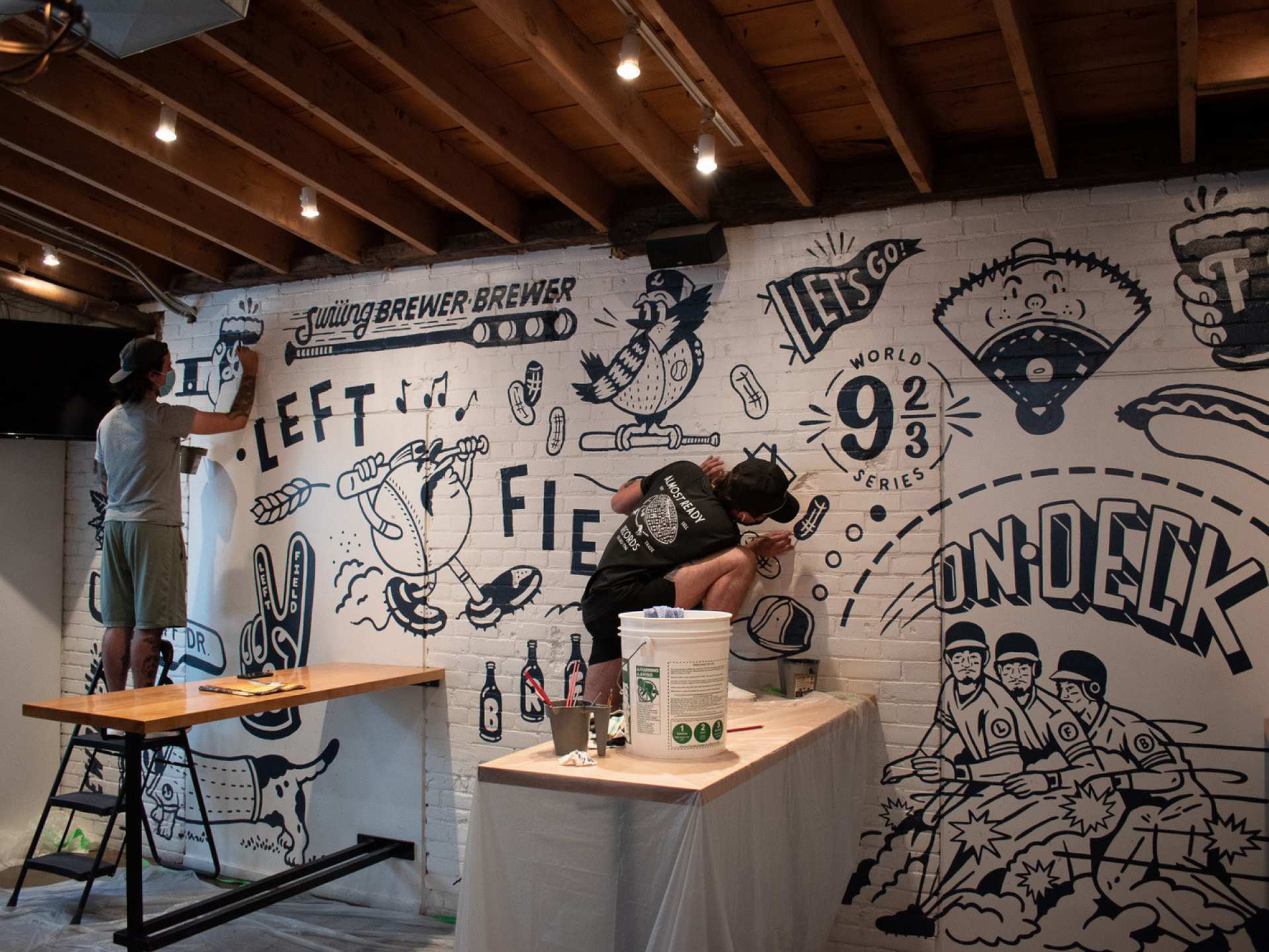 Toronto artists | Cam Miller creating the mural in Left Field Liberty Village
