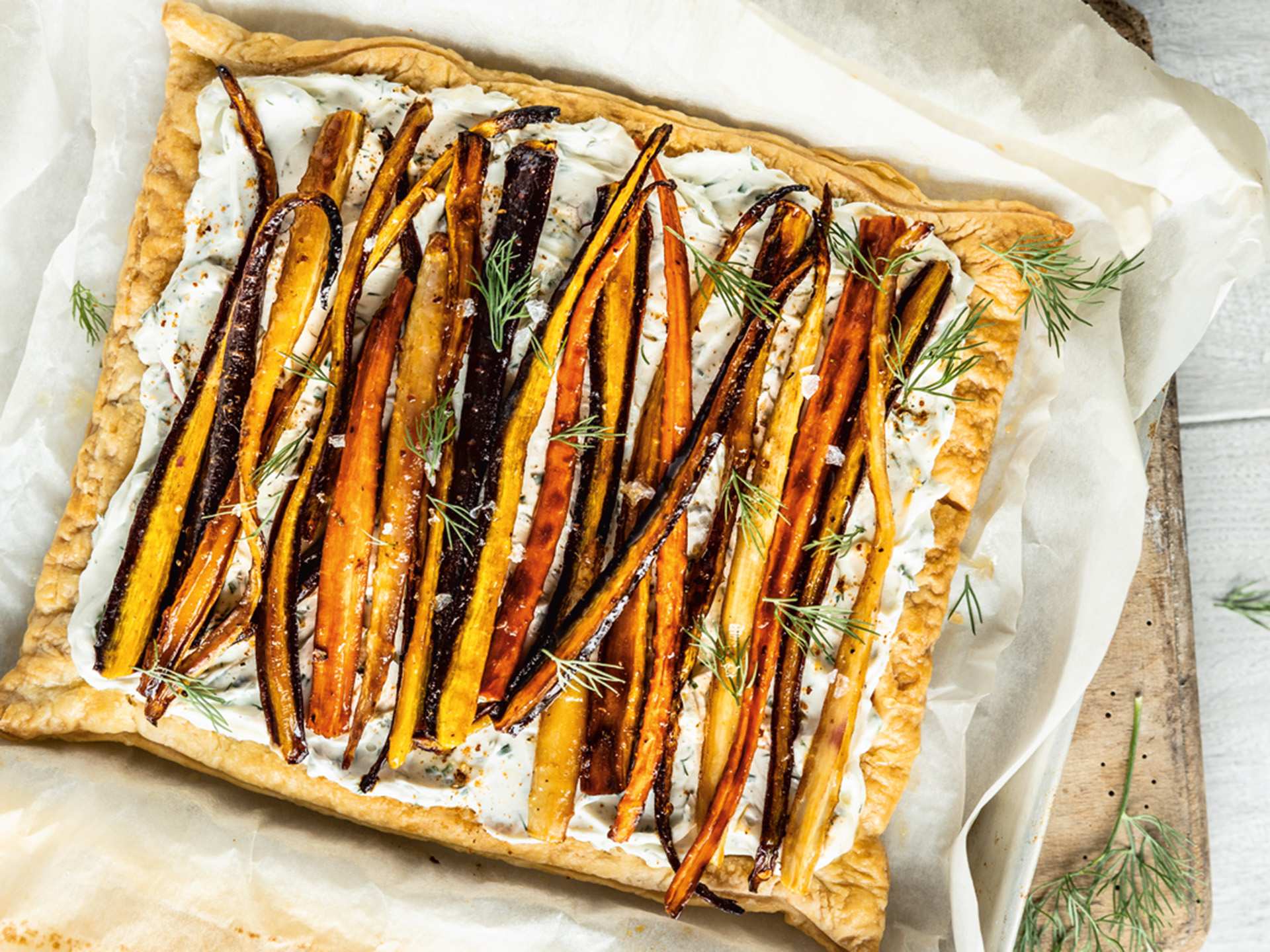 Harissa and maple roasted carrot tart with carrot-top dill cream cheese