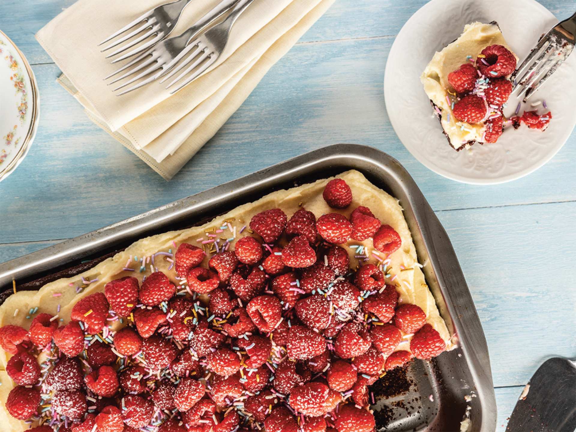 Chocolate sheet cake with raspberries and buttercream frosting