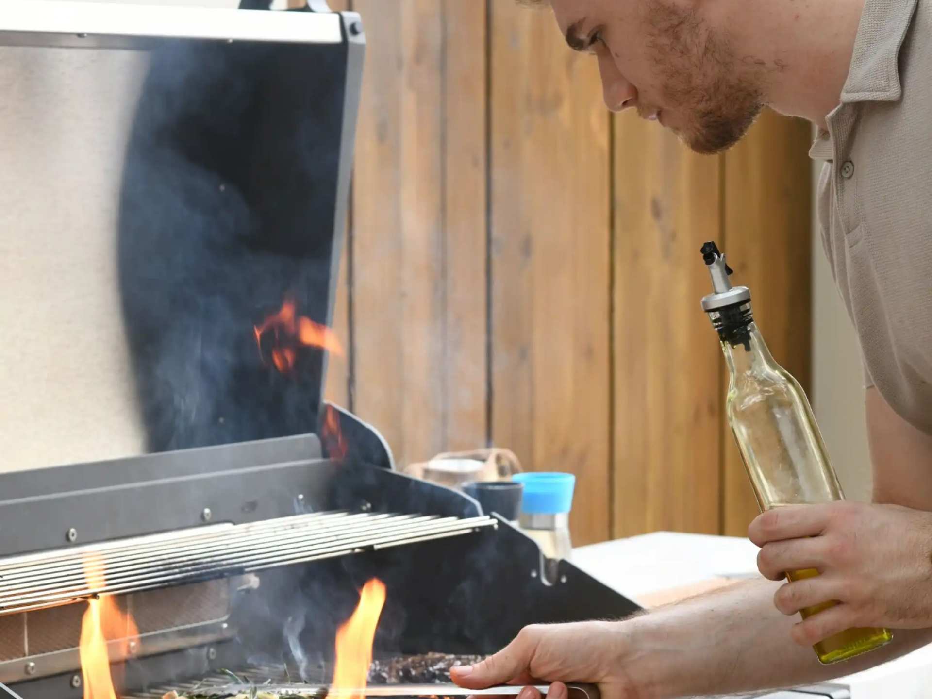 A man cooking on a Prokan Outdoor Kitchen