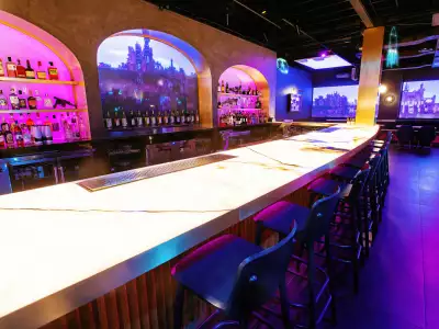 Offworld bar | The bar and purple shelves with liquor at Offworld bar on Queen West