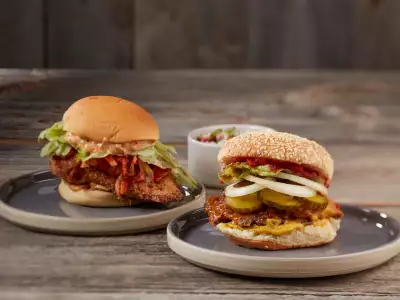 Best breweries in Toronto | Two stacked burgers on plates at Great Lakes Brewery