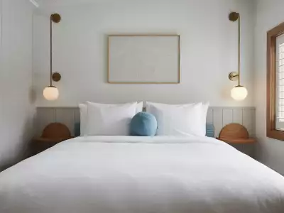 A bed inside a guest room at The Beach Motel, Southampton, Ontario
