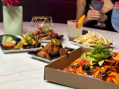 Best cocktail bars in Toronto | An assortment of food at Daisy