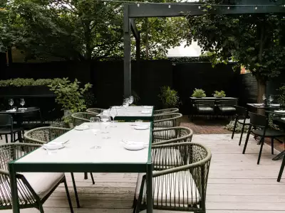 Tables and chairs on the patio at Henry's restaurant Toronto