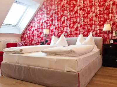 One of the red hotel rooms at Hotel Beethoven