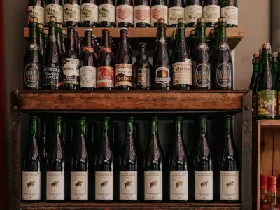 Toronto bottle shops and alcohol stores | Wine bottles lined up on a shelf at Bottega Volo in Littly Italy, Toronto