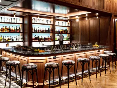 The best bars in Toronto | A bartender stocking shelves at Corsair at Marked