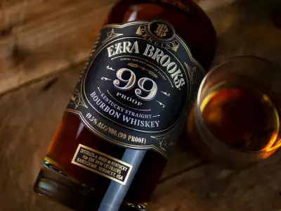 A bottle of Ezra Brooks 99 Proof and a glass of bourbon
