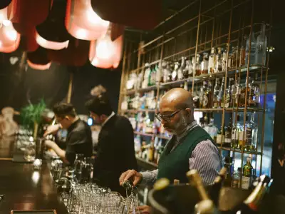 Visa Infinite Dining Series | Sommelier Christopher Sealy pours wine at the Alo Visa Infinite Dining Series