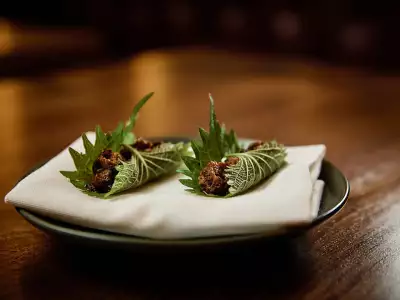 The best restaurants in Toronto | A course presented on a leaf at Akin Toronto