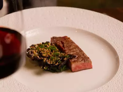 TIFF Toronto celebs | A glass of red wine and a steak dish, part of the TIFF tasting menu Caf&eacute; Boulud in Yorkville