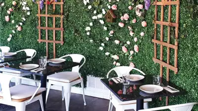 The flower wall inside La Fontana, one of the best Elora restaurants