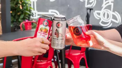 Brickworks Ciderhouse Toronto craft cider | Hands holding Batch: 1904 and seasonal ciders