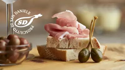 Prosciutto di San Daniele piled on a slice of bread
