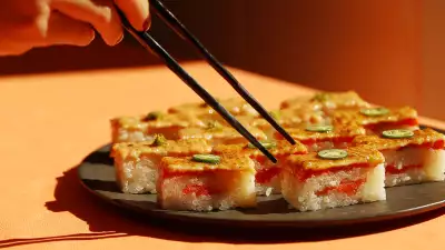 Sushi types and how to eat sushi | Chopsticks reach for a platter of salmon oshi at Minami Toronto