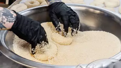 Toronto home cooks and their online food businesses | Rolling bagels in sesame seeds