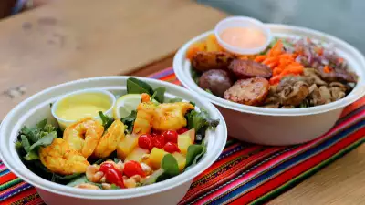 The best new restaurants in Toronto for summer 2021 | A Hot Brasa Chicken bowl and a Yellow Chili Pepper Shrimp salad from Brasa Peruvian Kitchen