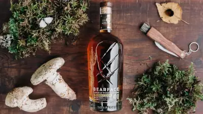 Bearface Matsutake whisky surrounded by mushrooms and moss