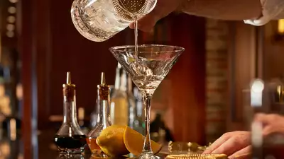 Toronto's best steakhouses | A bartender pours a martini at Hy's Steakhouse & Cocktail Bar