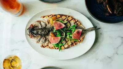 Taline Toronto | Tsoug, a whole grilled fish with zaatar, caper leaves, charred grapes and persimmon