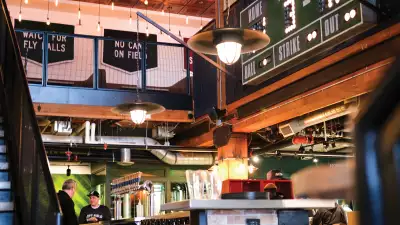 Toronto bottle shops and alcohol stores | The scoreboard and seating inside Left Field Brewery, Liberty Village, Toronto