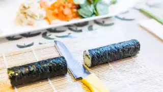 Places offering cool cooking classes in Toronto | A sushi roll being made in a class