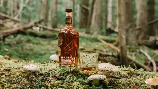 Bearface Matsutake whisky and a glass in the forest