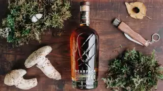 Bearface Matsutake whisky surrounded by mushrooms and moss