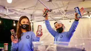 Brand ambassadors hand out drinks at Fizz Fest