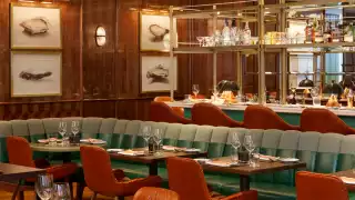 Accessible restaurants in Toronto | Plush booths inside Café Boulud