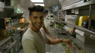 Mena Massoud | Aladdin actor Mena Massoud in a kitchen smiling Mena Massoud | Aladdin actor Mena Massoud in a kitchen smiling