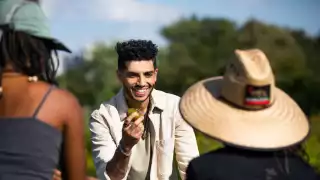 Mena Massoud | Aladdin actor Mena Massoud holding a tomato in a field Mena Massoud | Aladdin actor Mena Massoud holding a tomato in a field