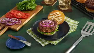 A burger dressed with Hellmann's Real Mayonnaise