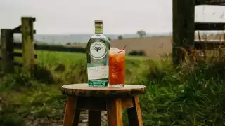 Ramsbury Gin Fall | The Estate Snapper, twist on a Bloody Mary sits on a stool in an English field