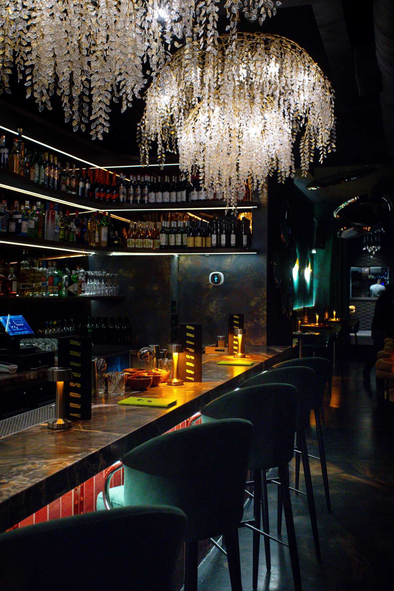 Chandeliers above the bar at Rhapsody on Ossington in Toronto Chandeliers above the bar at Rhapsody on Ossington in Toronto