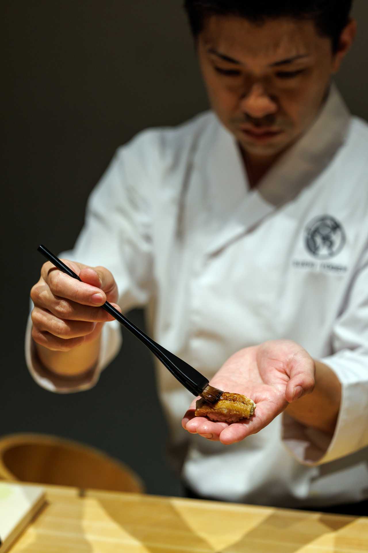 Sushi Yugen omakase in Toronto | Head chef Kyohei Igarashi prepares a piece of nigiri Sushi Yugen omakase in Toronto | Head chef Kyohei Igarashi prepares a piece of nigiri