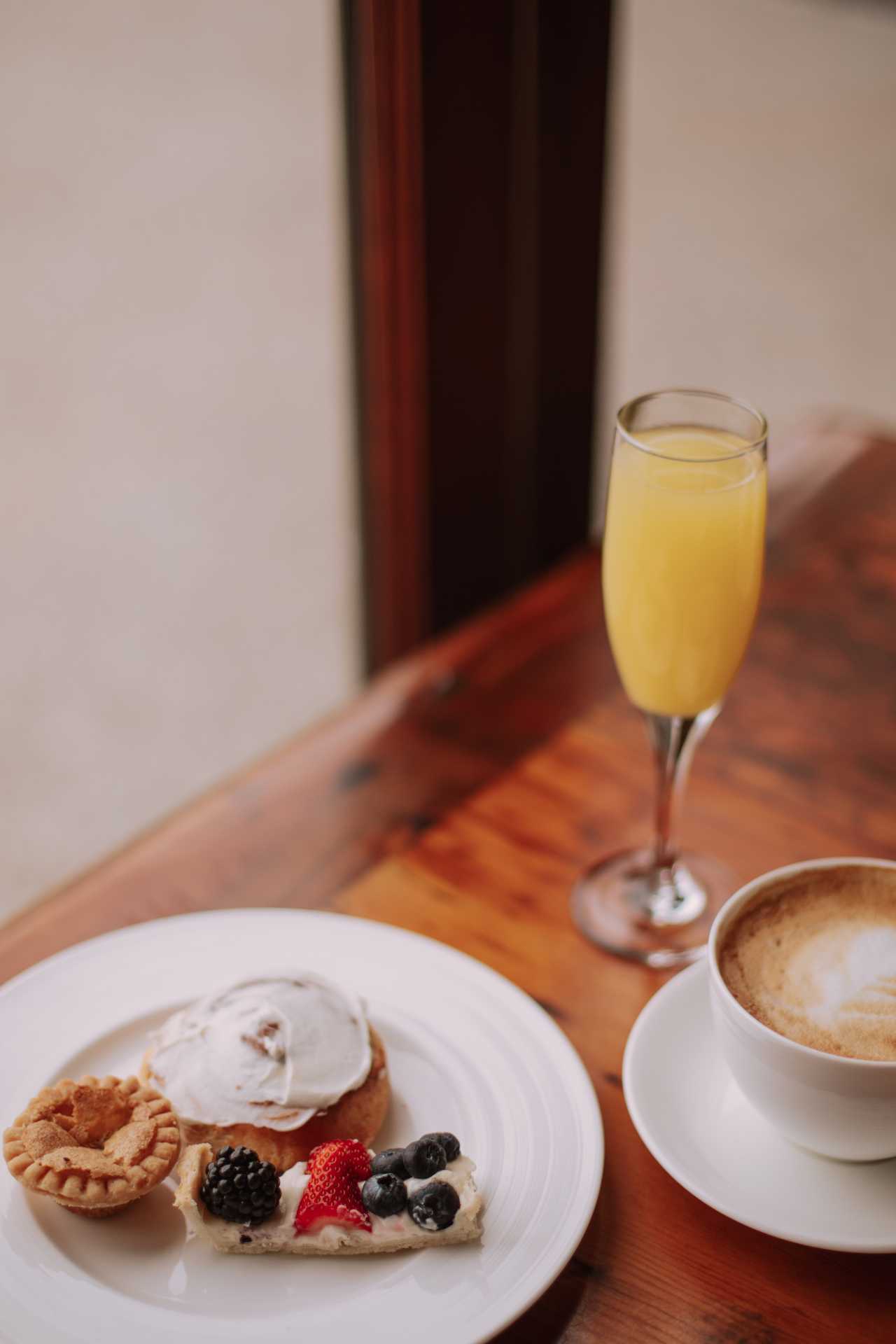 Cambridge Mill | A mimosa, plate of desserts and a coffee at the Cambridge Mill brunch Cambridge Mill | A mimosa, plate of desserts and a coffee at the Cambridge Mill brunch