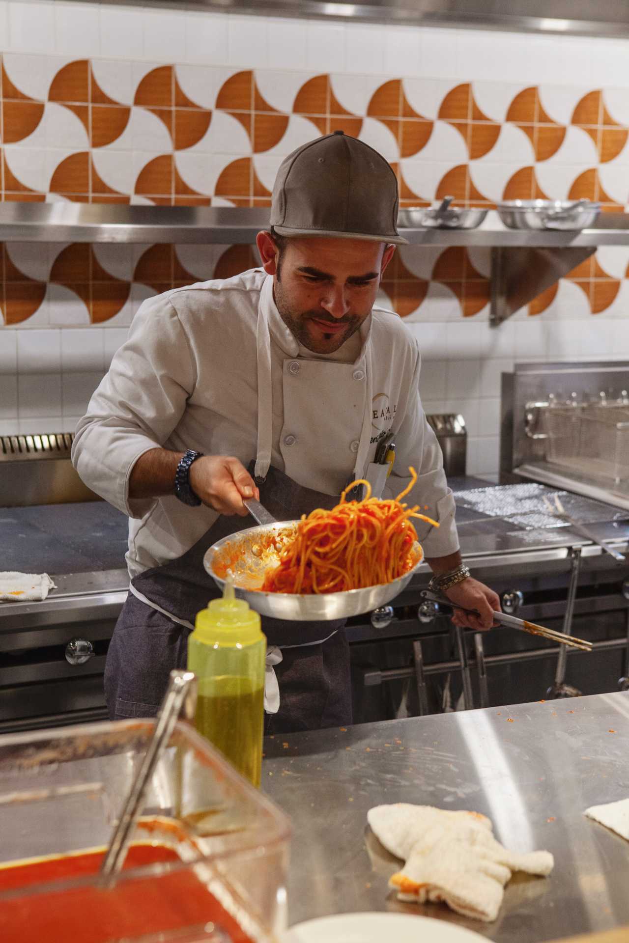 Best Italian restaurants in Toronto | A chef cooking pasta at Eataly, Toronto