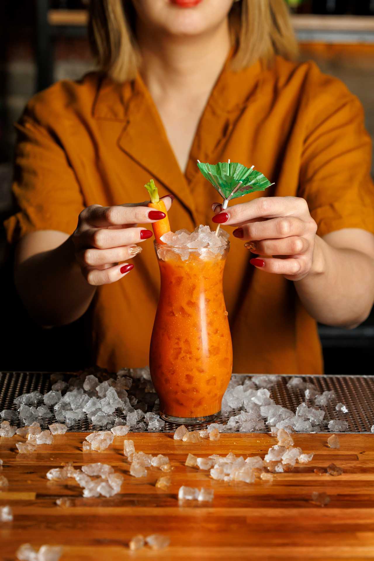 The best bars in Toronto | A bartender garnishing the I Was In The Pool cocktail at Cry Baby Gallery