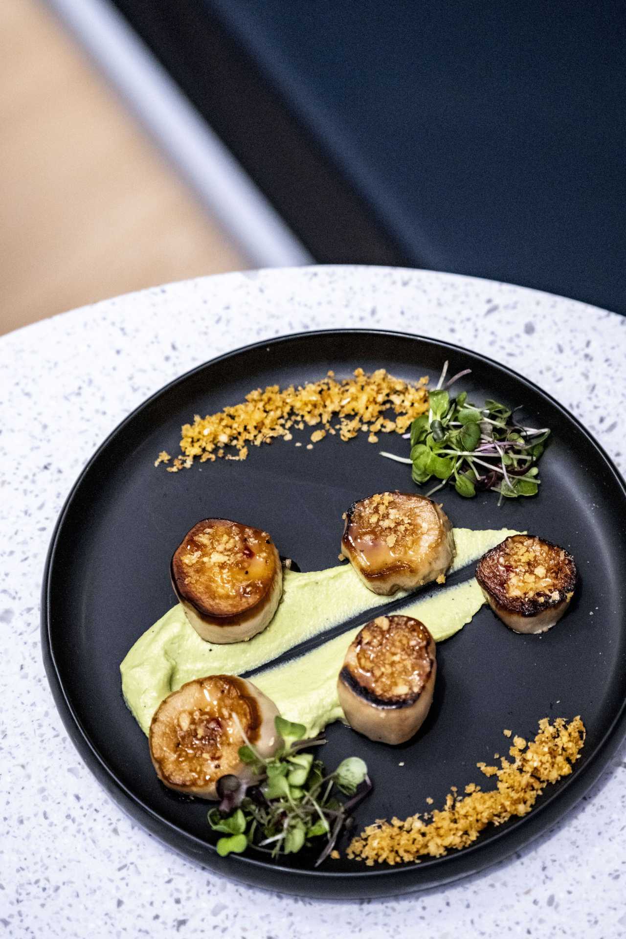The best bars in Toronto | Mushroom scallops with greens to garnish at Electric Bill