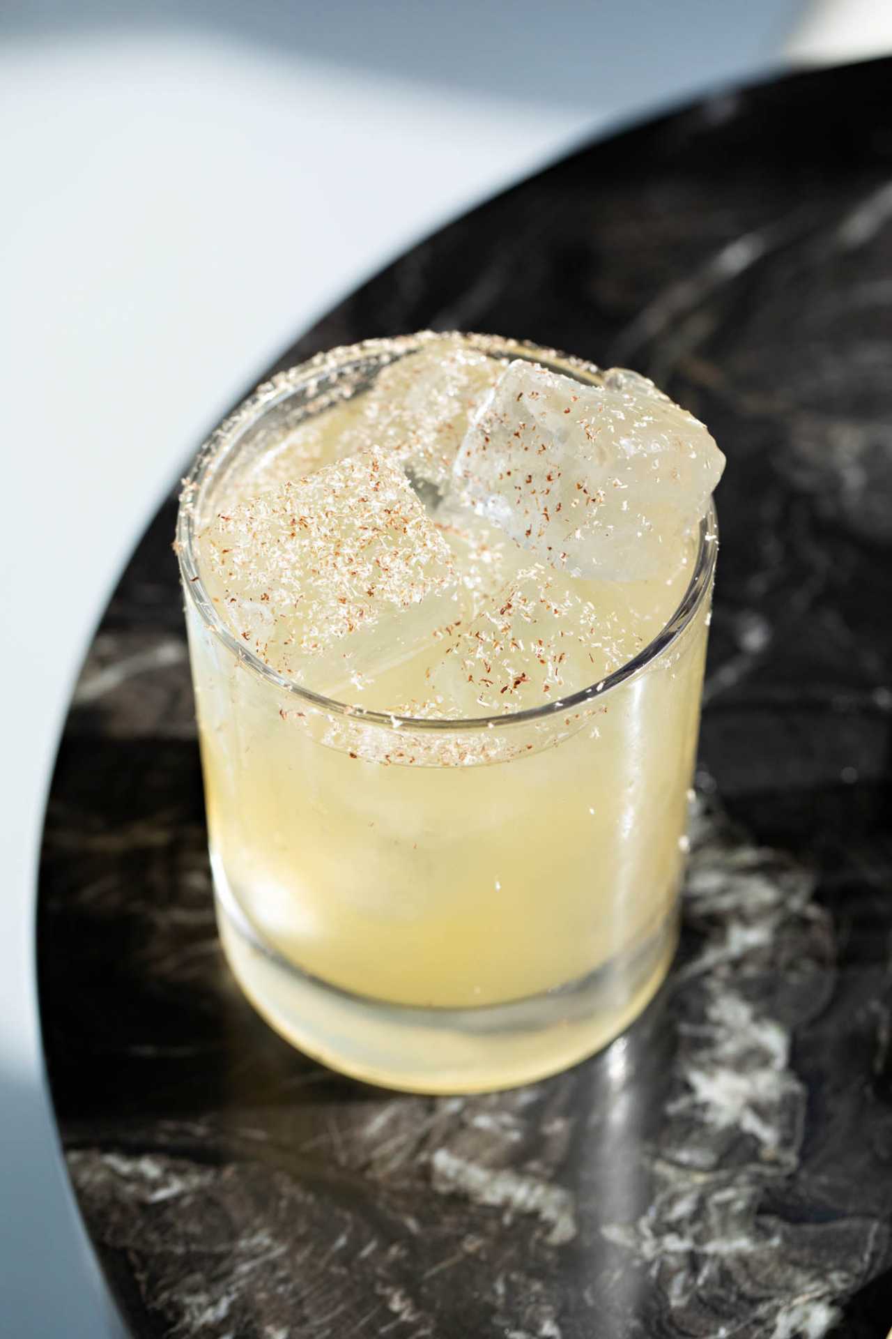 The best bars in Toronto | A yellow cocktail in a rocks glass at Simpl Things