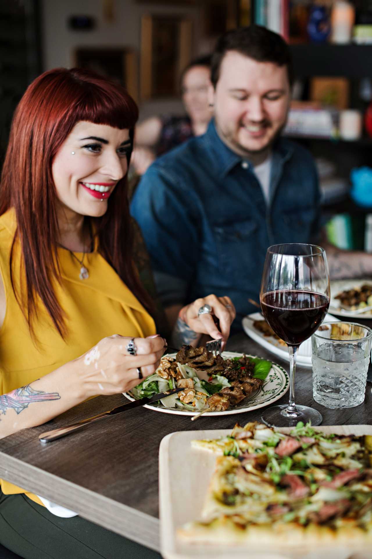 Canada Beef | A couple enjoy food and a glass of red wine Canada Beef | A couple enjoy food and a glass of red wine