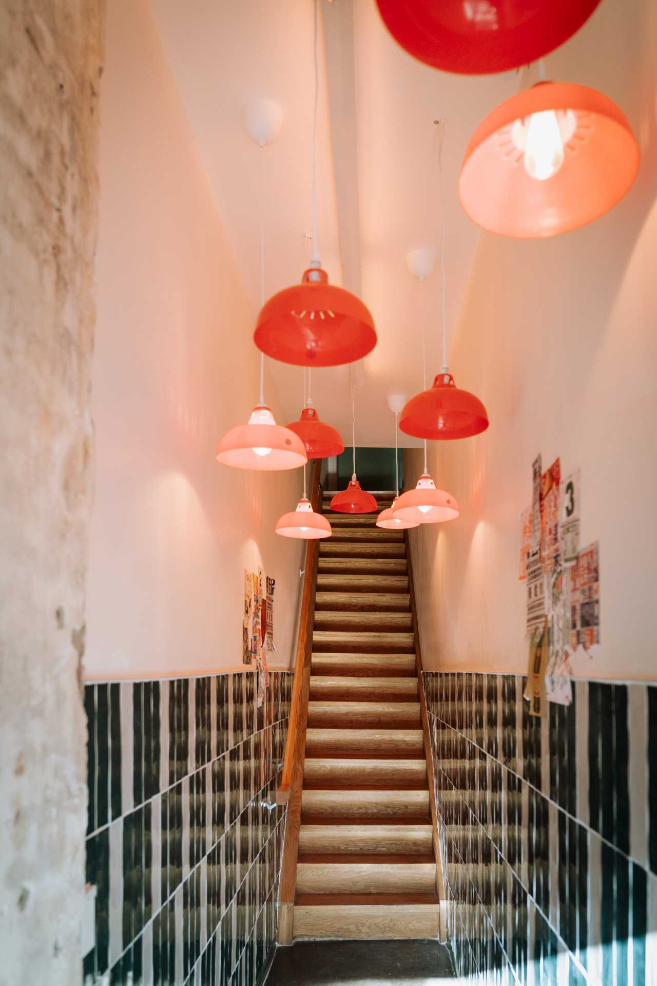 Best new restaurants Toronto | Hanging lights in the stairway entrance to Ayla Upstairs