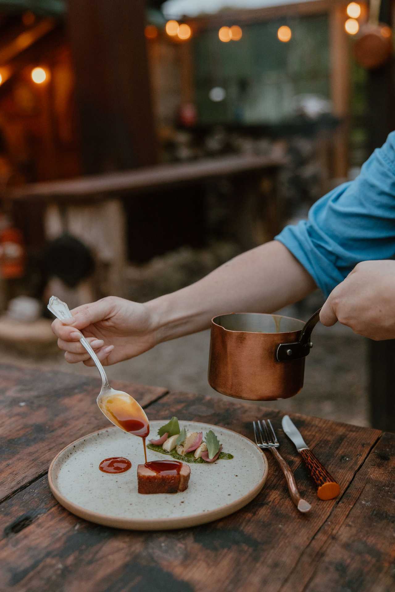 Food Trends 2026 | A hand spoons a sauce on a dish at Down Home in Markdale