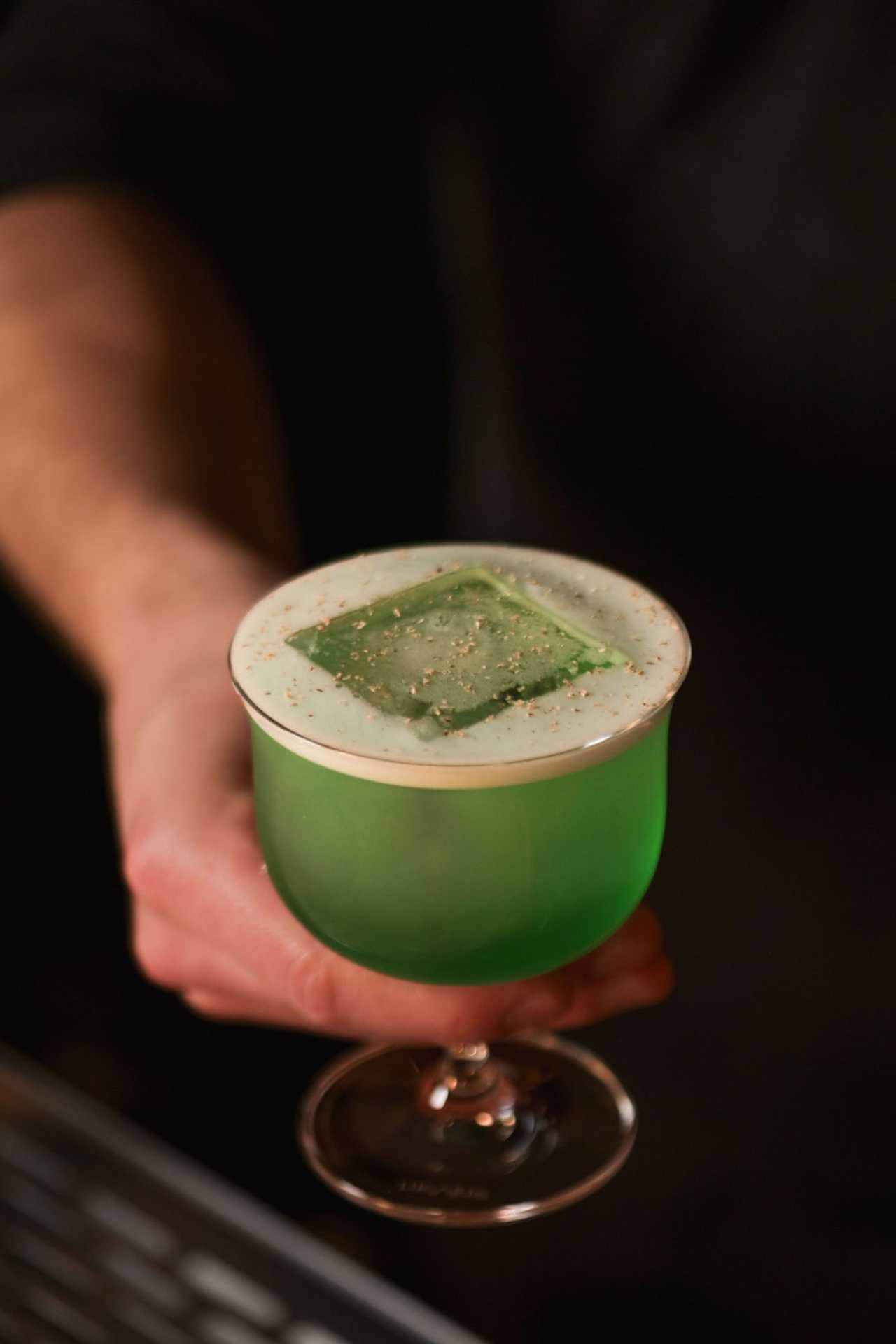 The best bars in Toronto | A green cocktail at Bar Banane